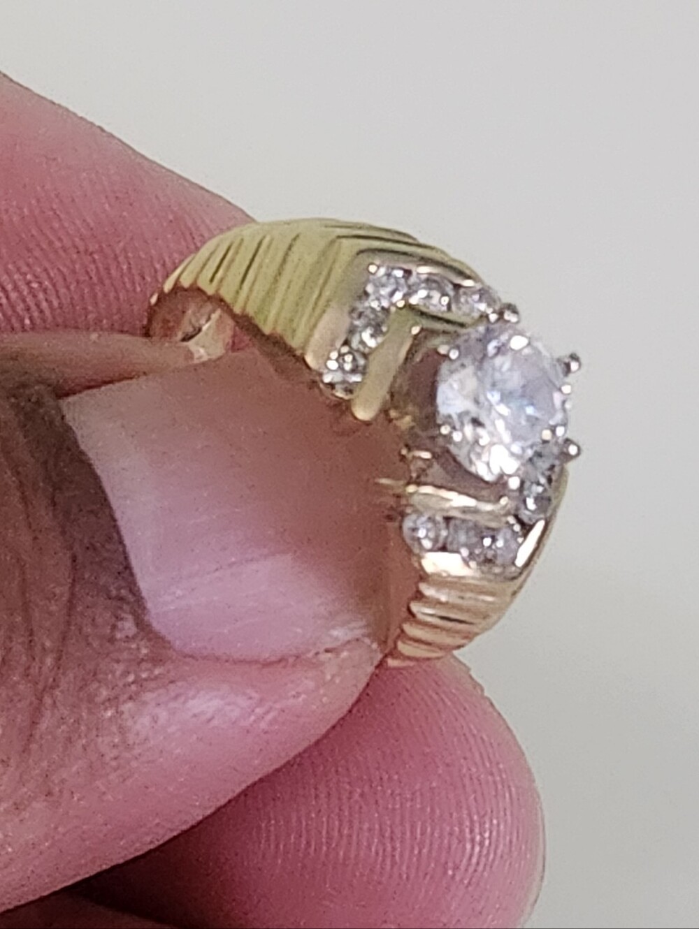 This 14K Yellow Gold 1.25 CT Lab Grown Diamond Ring is an elegant and luxurious